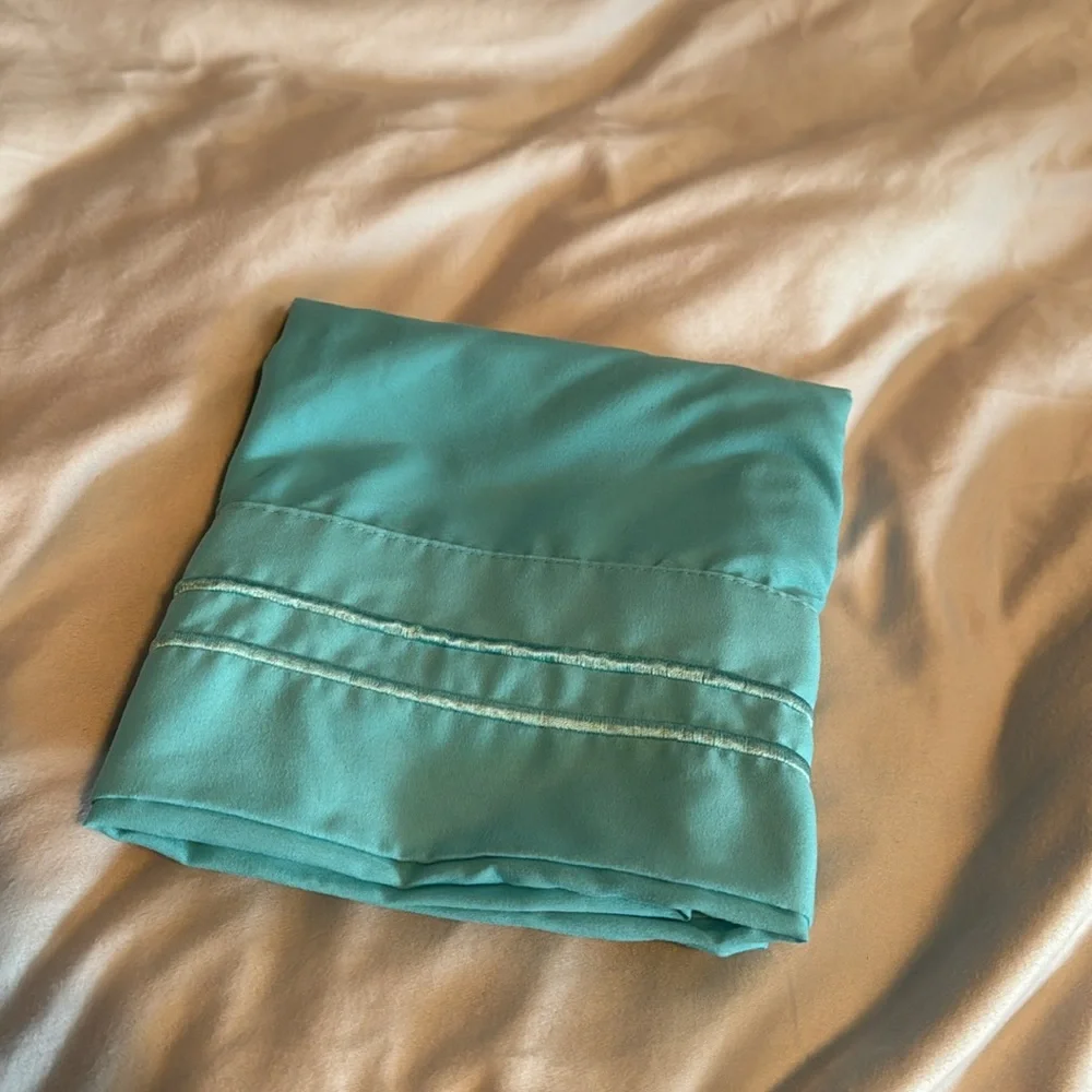 Pair of two microfiber pillowcases in turquoise blue. EUC
